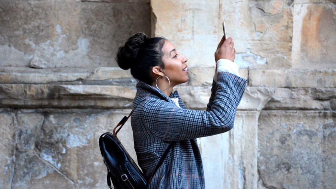 Woman taking photo with her smart phone