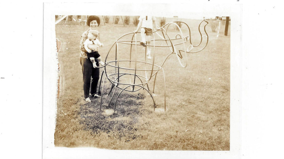 Jac T Bowen's custom sculpture, an elephant, in a backyard with the family