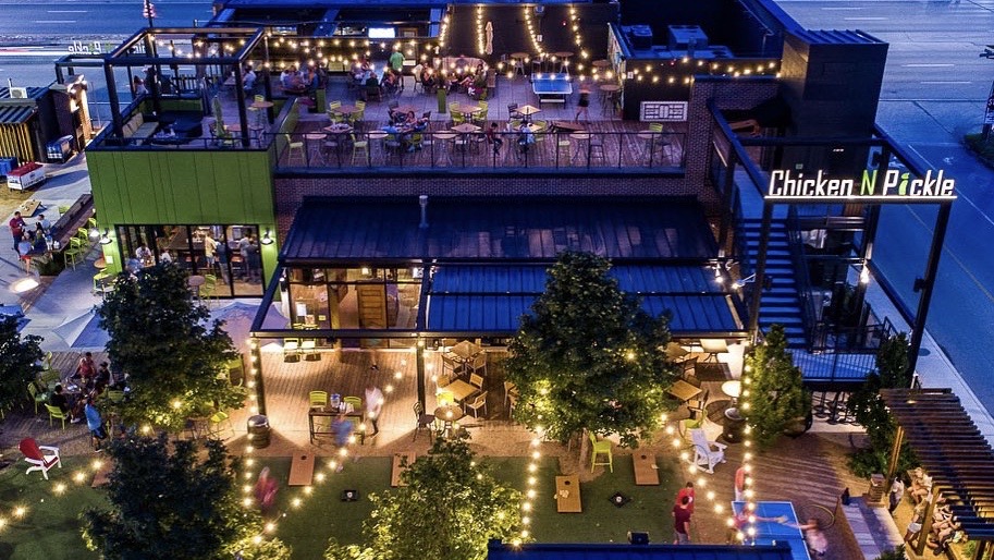 An aerial view of Chicken N Pickle restaurant and pickle ball courts.