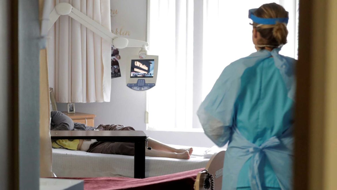 Health care worker with nursing home resident