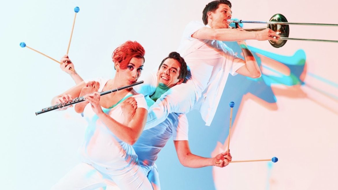 Three performers pose with instruments.