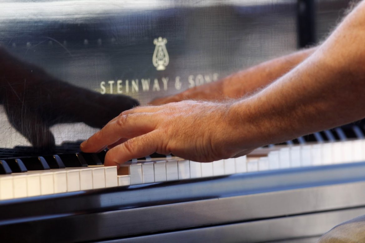 John Cleary playing piano
