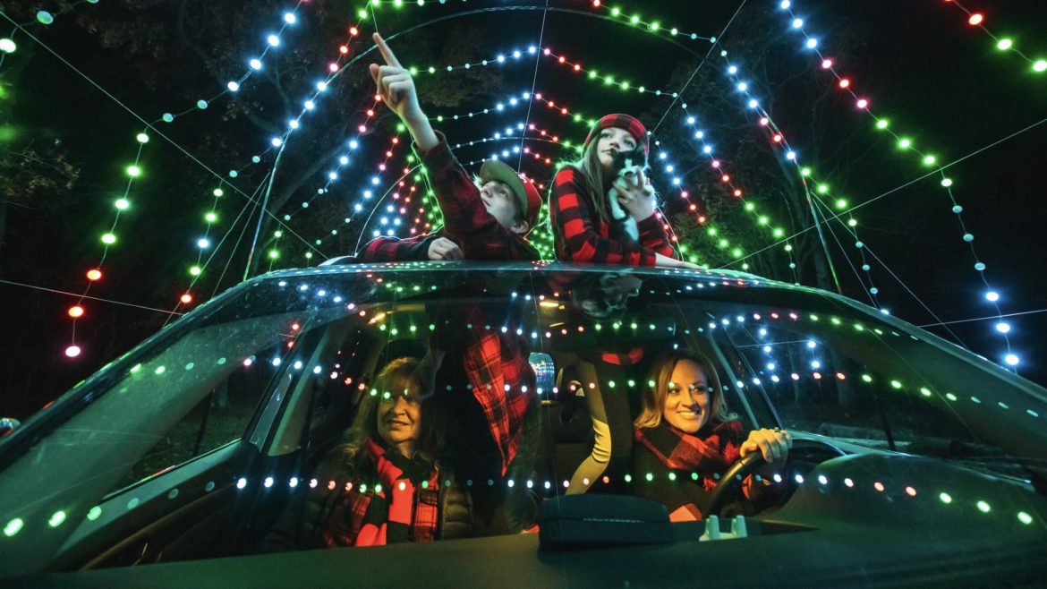 A family drives through a Winter Magic light display.