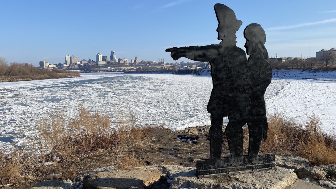 A Lewis and Clark statue pointing toward the KC skyline.