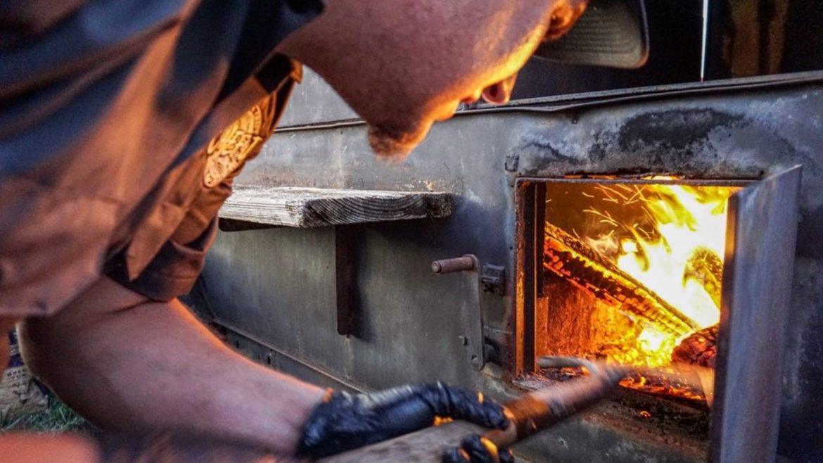 Justin Easterwood of Chef J BBQ in the West Bottoms manages the fire.
