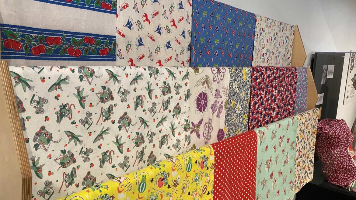 A display of feed sack patterns at the Thrift Style exhibit now showing the Johnson County Museum.