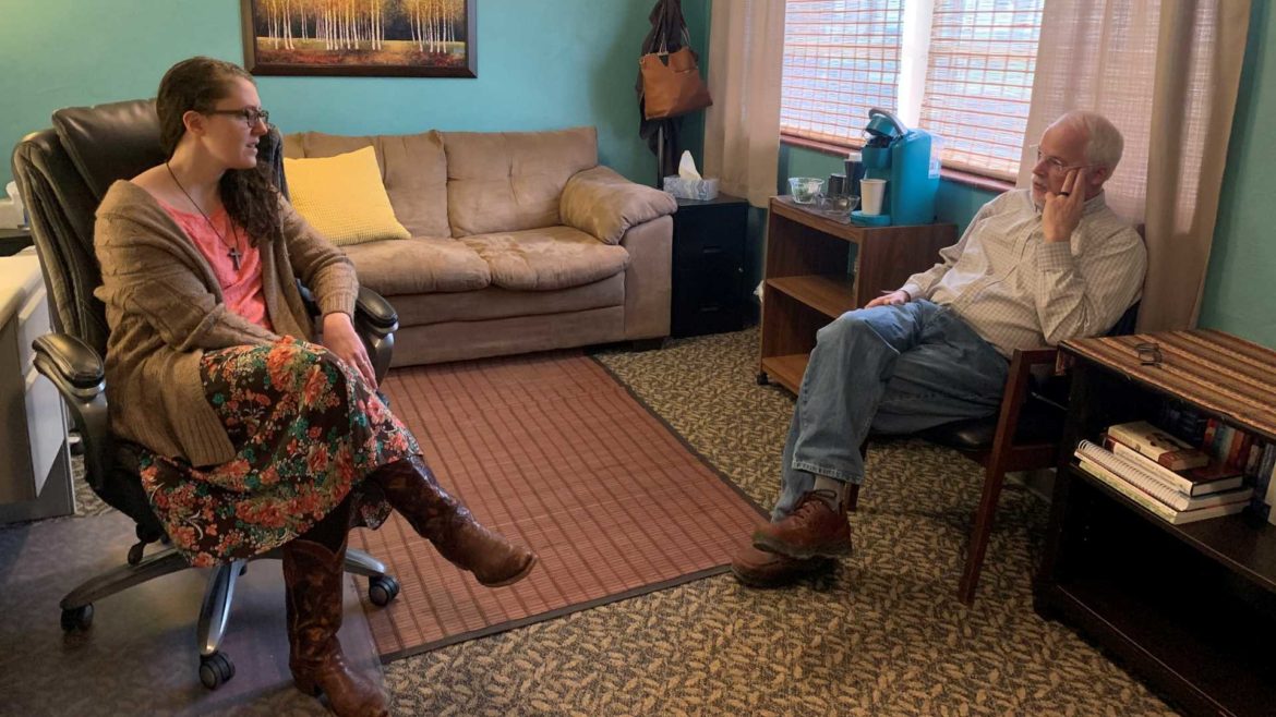 Amy Taft and Dr. John Hudson talk in their office located in the basement of the First Christian Church of Cameron, Missouri.