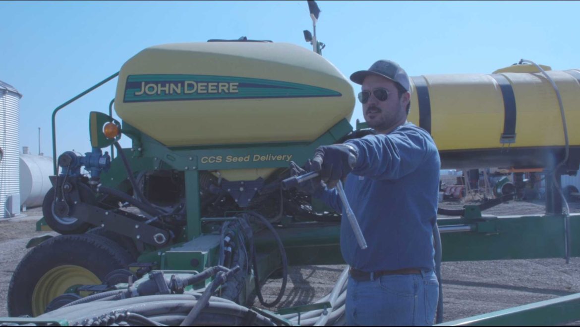 Trey Garst works on his planter in preparation for a welder to come on March 5, 2021.