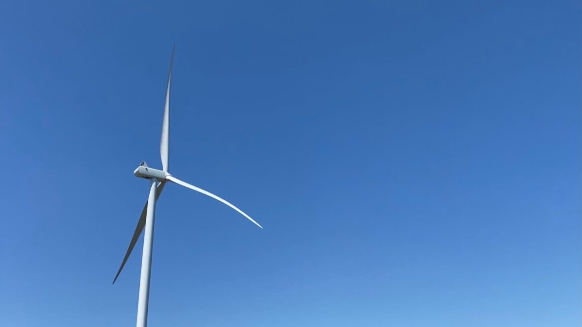 A wind turbine towers above Queen City, Missouri.