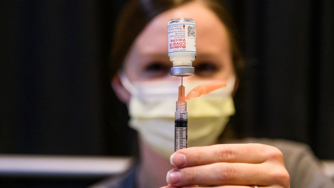 Syringes of COVID-19 vaccinations are filled during MU Health Care’s mass vaccination clinic at the Walsworth Family Columns Club at Faurot Field in Columbia on Feb. 4, 2021.
