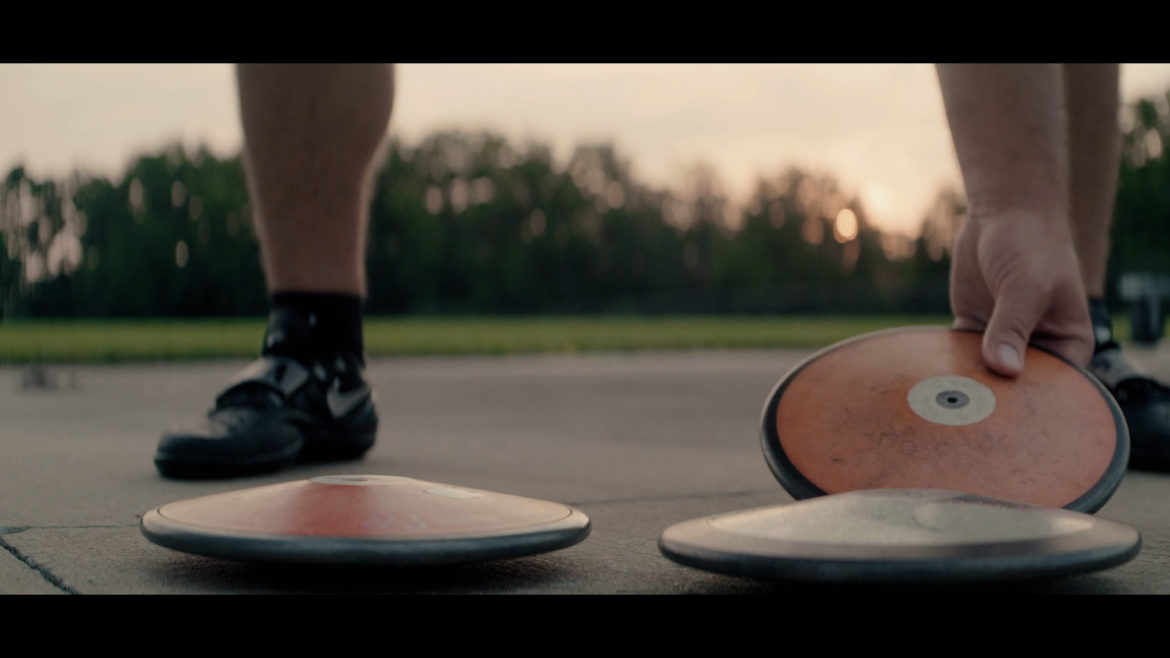 Mason Finley prepares to throw the discus in a scene from "Chasing Gold."