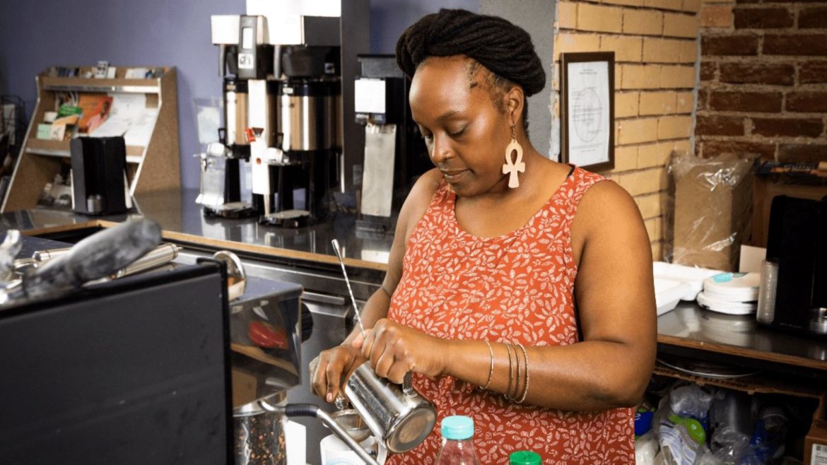 Nika Cotton makes a drink at Soulcentricitea, which she opened on Troost Ave. last July. Cotton applied for a grant from the Restaurant Revitalization Fund, but did not receive any money.