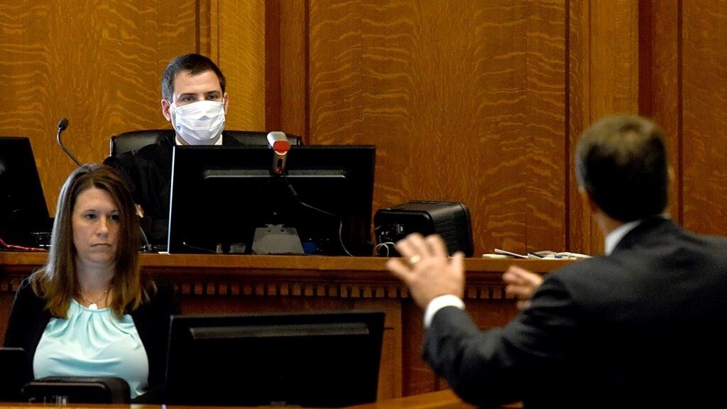 Boone County Circuit Judge Brouck Jacobs, center, listens to opening statements Tuesday as Solicitor General John Sauer argues for an order blocking mask rules in public schools.
