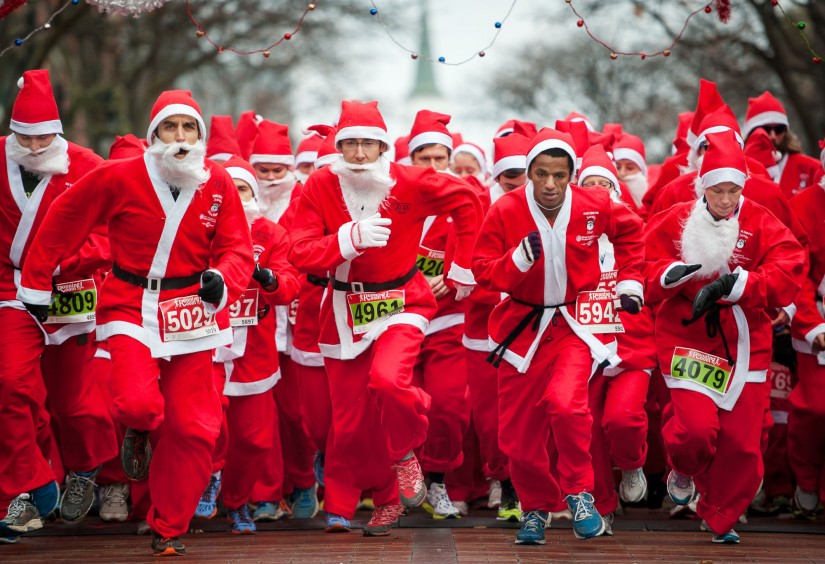 People dressed as Santa start the 5k race.
