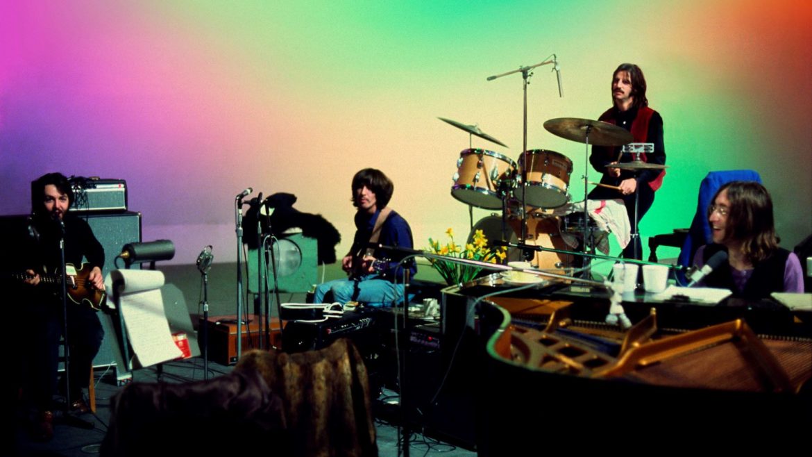 This image released by Disney+ shows, from left, Paul McCartney, George Harrison, Ringo Starr and John Lennon in a scene from the nearly 8-hour Peter Jackson-produced documentary "Get Back."