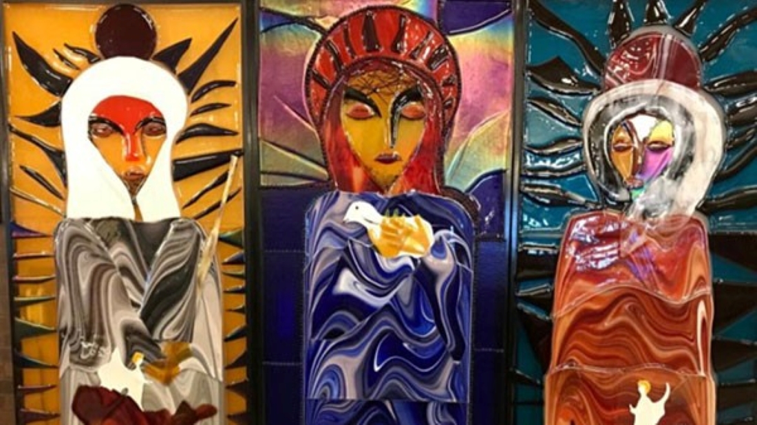The Holy Family — Jesus, Mary and Joseph — are depicted in Hasna Sal’s glass artwork on display at a Catholic center in Kansas City, Kansas.