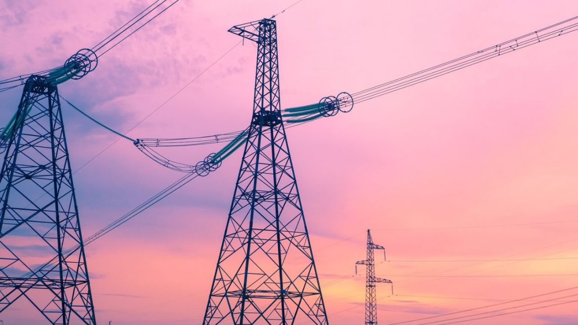 A view of power lines against a pink sunset illustrates a story about how the climate changes affect utility costs and burdens. Flatland reporters Vicky Diaz-Camacho and Catherine Hoffman will report on this issue for the next Flatland Show episode, entitled "The Cost of Utilities in Kansas City."