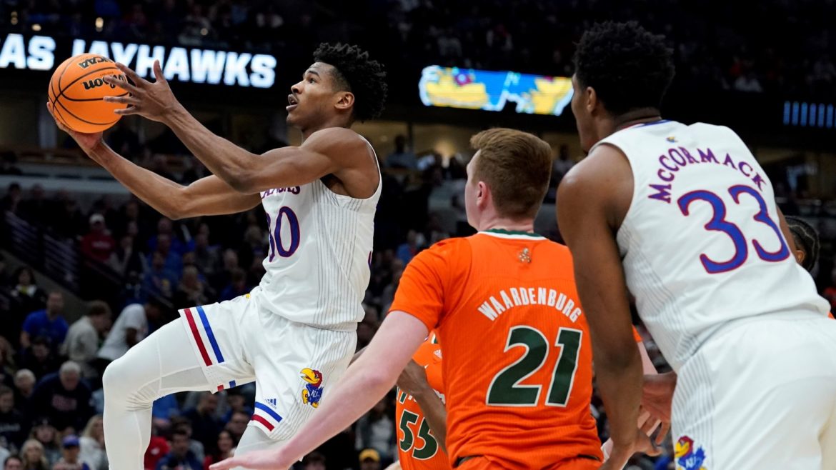 Kansas' Ochai Agbaji shoots during the second half of a college basketball game in the Elite 8 round of the NCAA tournament Sunday, March 27, 2022, in Chicago.