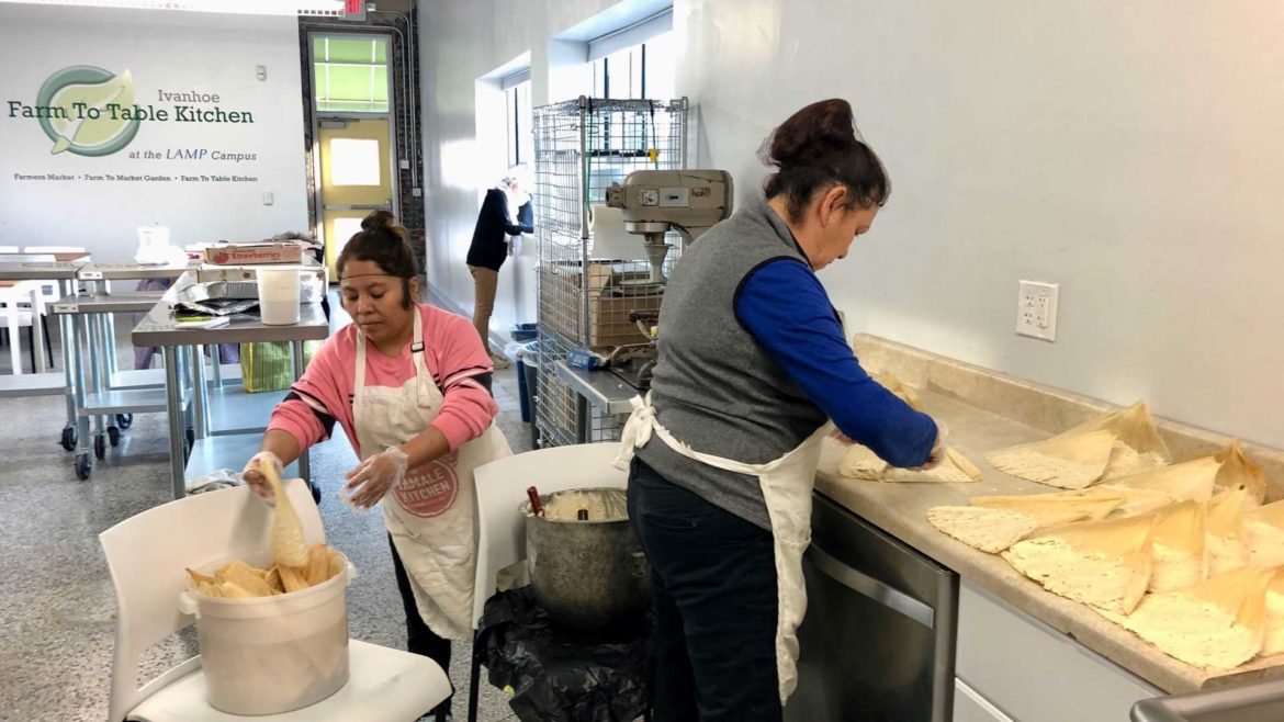 Lupe Quijano and Gigi Reyes, original members of The Tamale Kitchen, spend a Friday evening making tamales to supplement their family incomes. A new investor has set the stage for the next stage of the organization’s growth.