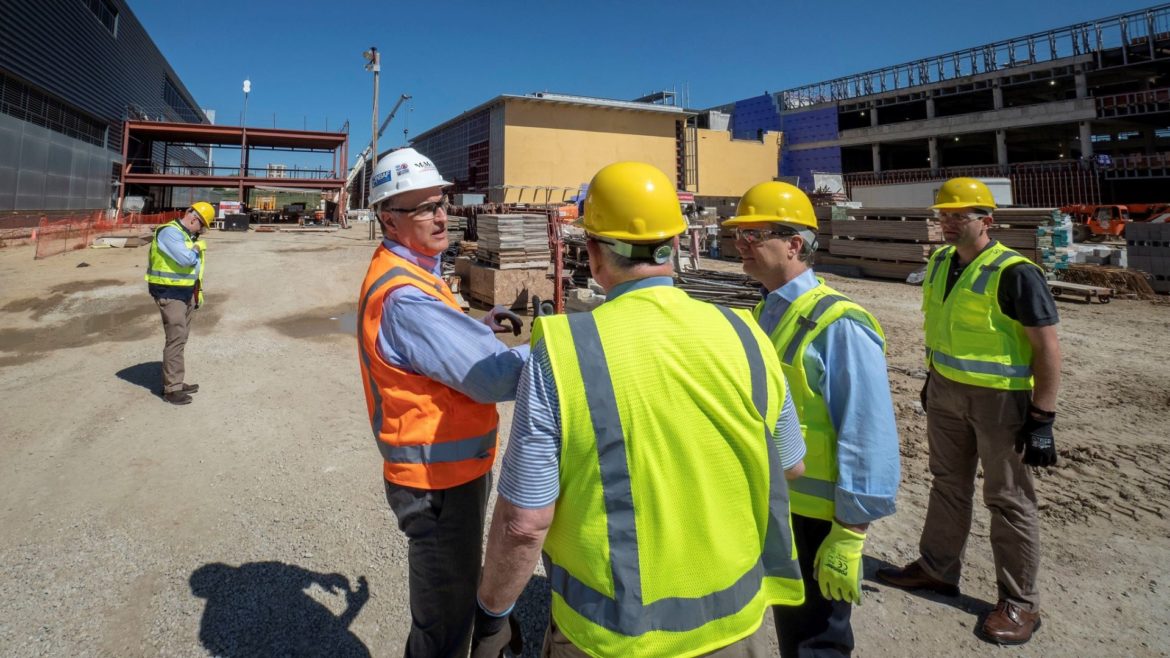 U.S. Department of Agriculture Secretary Sonny Perdue, joined by Sen. Pat Roberts (R-KS) and Sen. Jerry Moran (R-KS), is briefed by National Bio and Agri-Defense Facility Site Project Manger Tim Barr about the status of the facility being built on the Kansas State University campus in Manhattan, Kansas, on May 30, 2018.