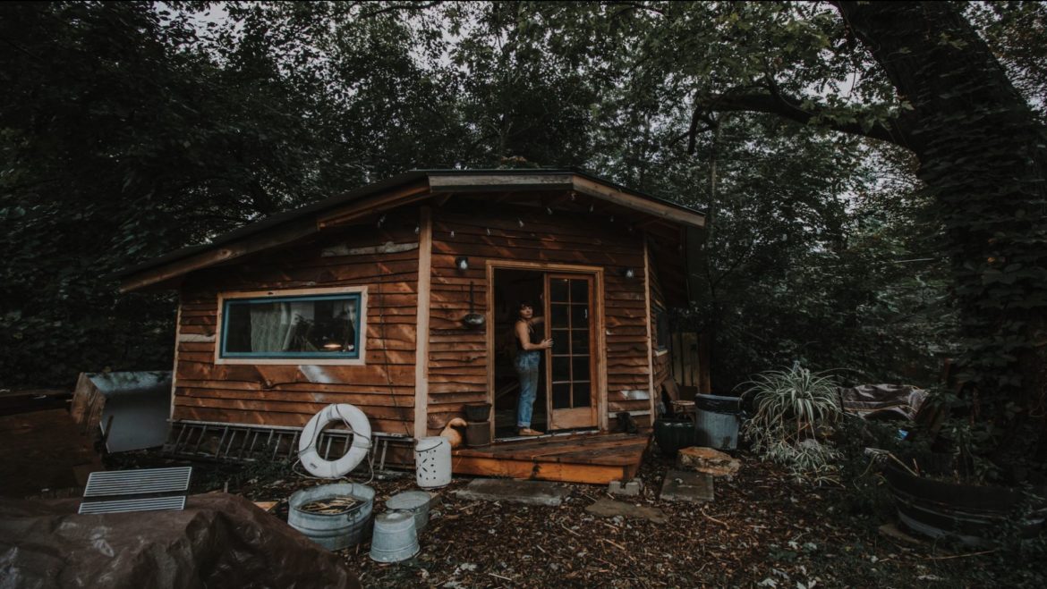 Broomsquire Amanda Lee Lazorchack at the entrance of her workshop.