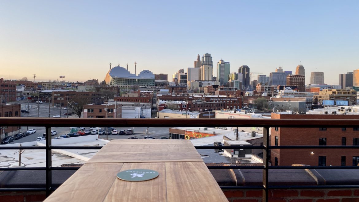 The north-facing view of the downtown skyline from Percheron on top of the Crossroads Hotel.