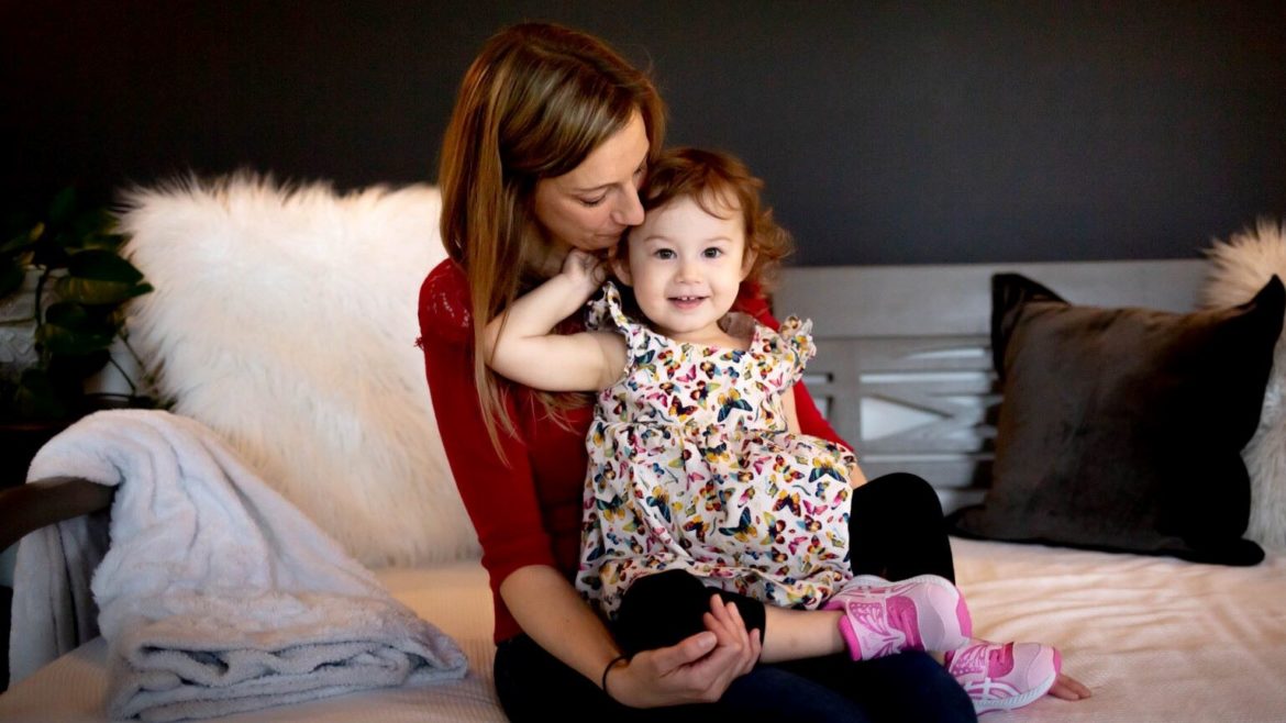 Lisa Pascoe with her 2-year-old daughter on March 23, 2022, at their home Clarkson Valley, Mo.