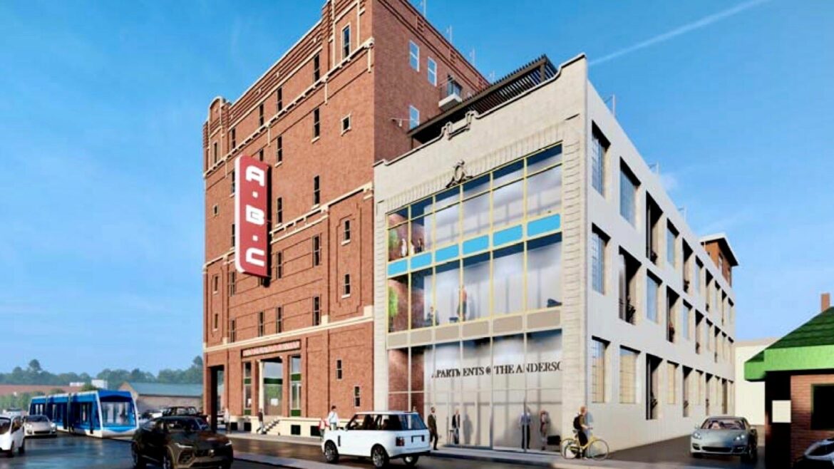The six-story historic ABC Storage building at 3244 Main St. and the adjoining former Anderson Electric Car building.