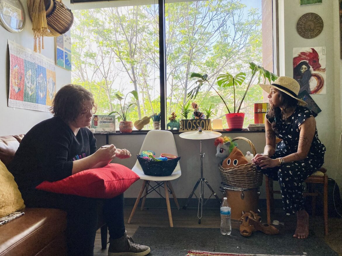 Atticus said he's grateful to his therapist, Sindhu Fedosyuk, for helping him embrace coming out. He said one emotional moment was when she helped wash and style his hair. (Vicky Diaz-Camacho | Flatland)