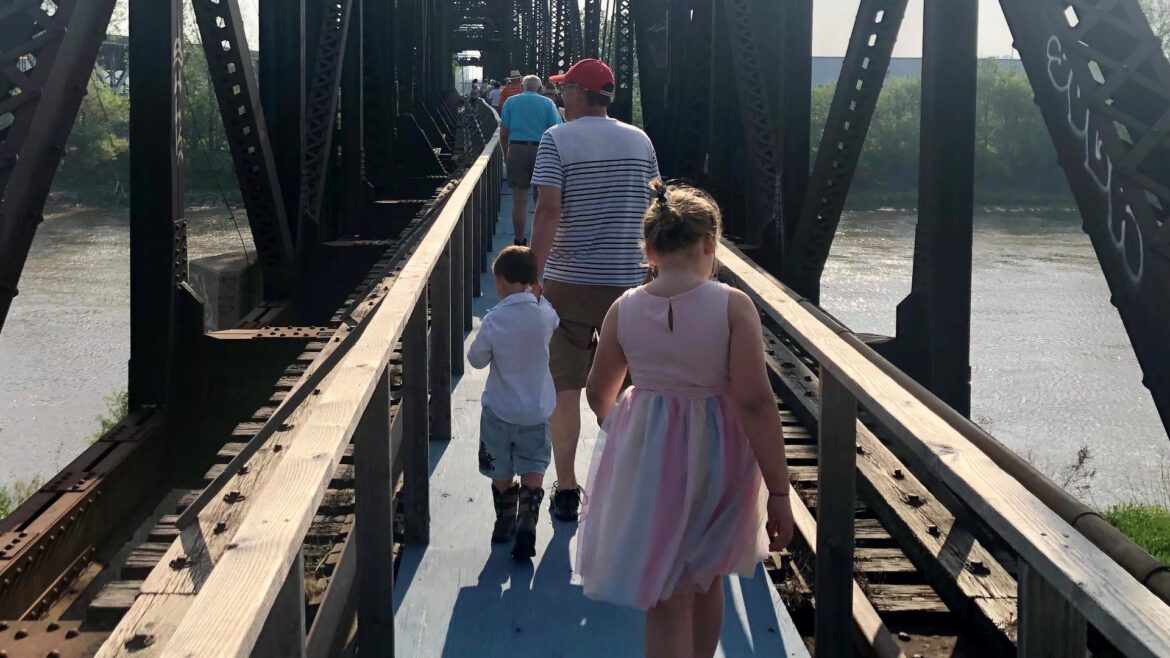 Mike Zeller leads a tour of the old Rock Island Bridge where he plans to create an entertainment district over the Kaw River.