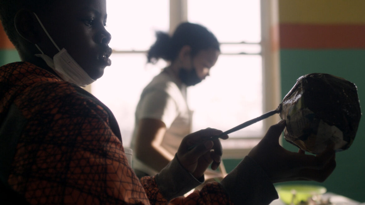 Young people painting at the Mattie Rhodes Center.