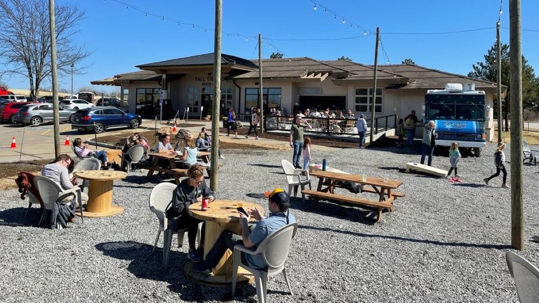 Patrons enjoy the outdoor patio space at Tall Trellis in Olathe.