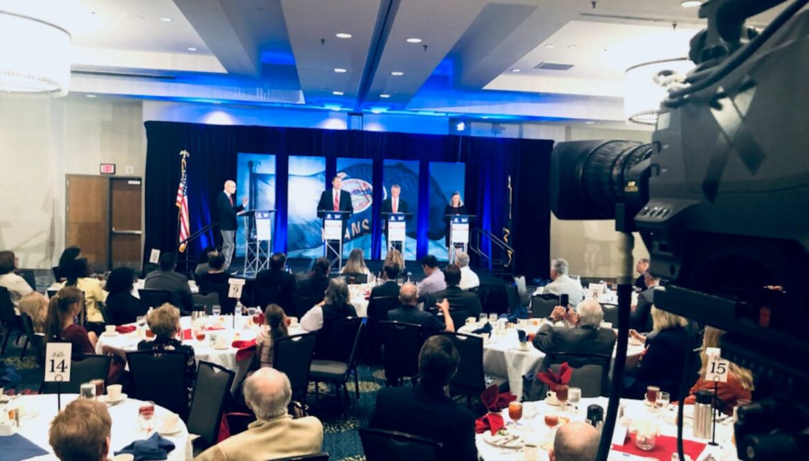 Republican candidates for Kansas attorney general - Kris Kobach, Tony Mattivi and Kellie Warren - on stage at the DoubleTree Hotel in Overland Park..