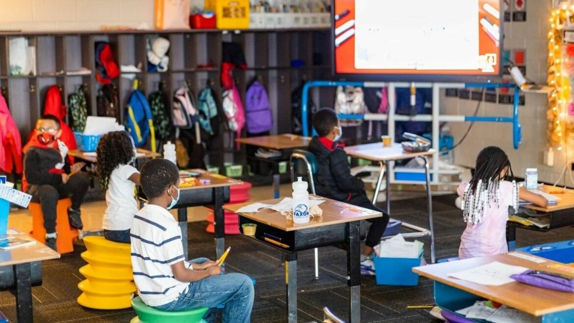 Members of a second grade class sit in their chairs at Faxon Elementary School in Kansas City.