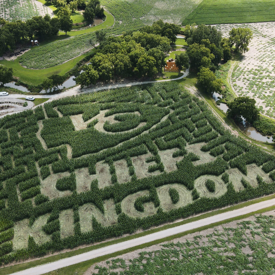 An aerial photo shows the Kansas City Chief's icon cut into a corn field with the words "Chiefs Kingdom"
