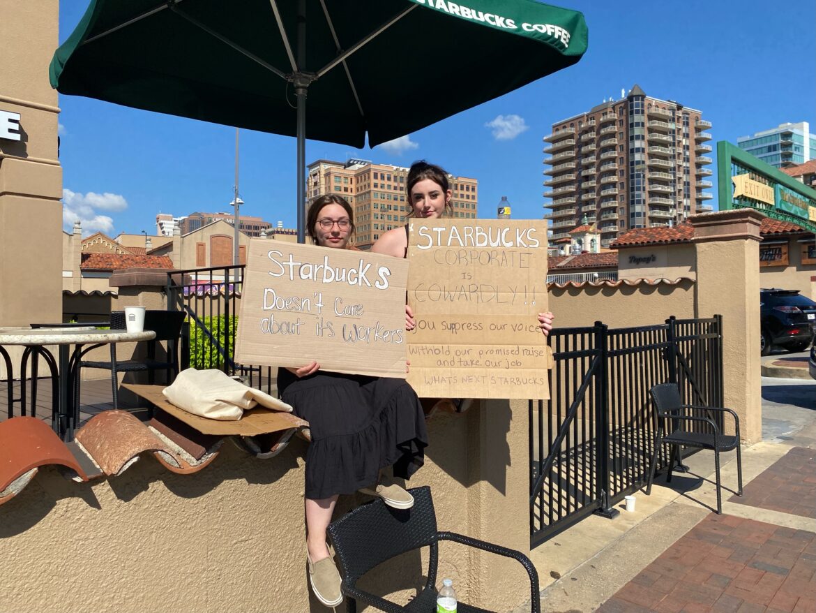 McKenzie Mays and Addy Wright protest outside of their former employer, Starbucks.