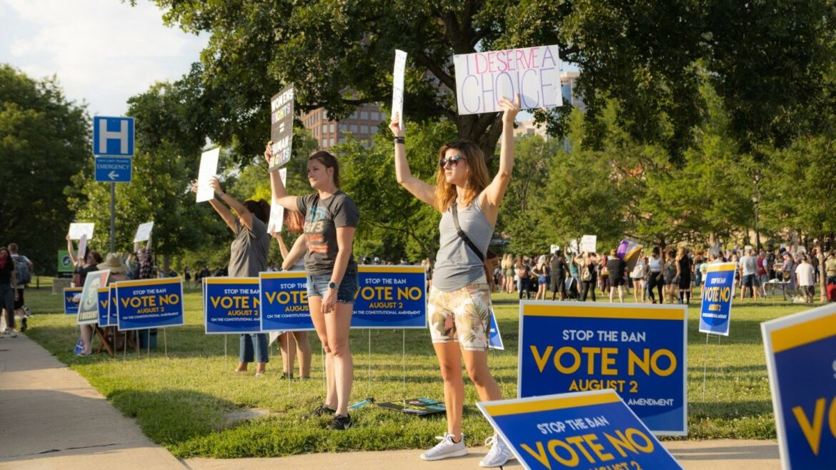 People at a rally for abortion access at Mill Creek Park near the Country Club Plaza.