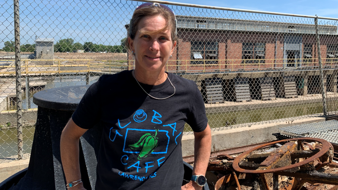 Sarah Hill-Nelson standing in front of Bowersock Mills & Power Co.’s hydroelectric plant.