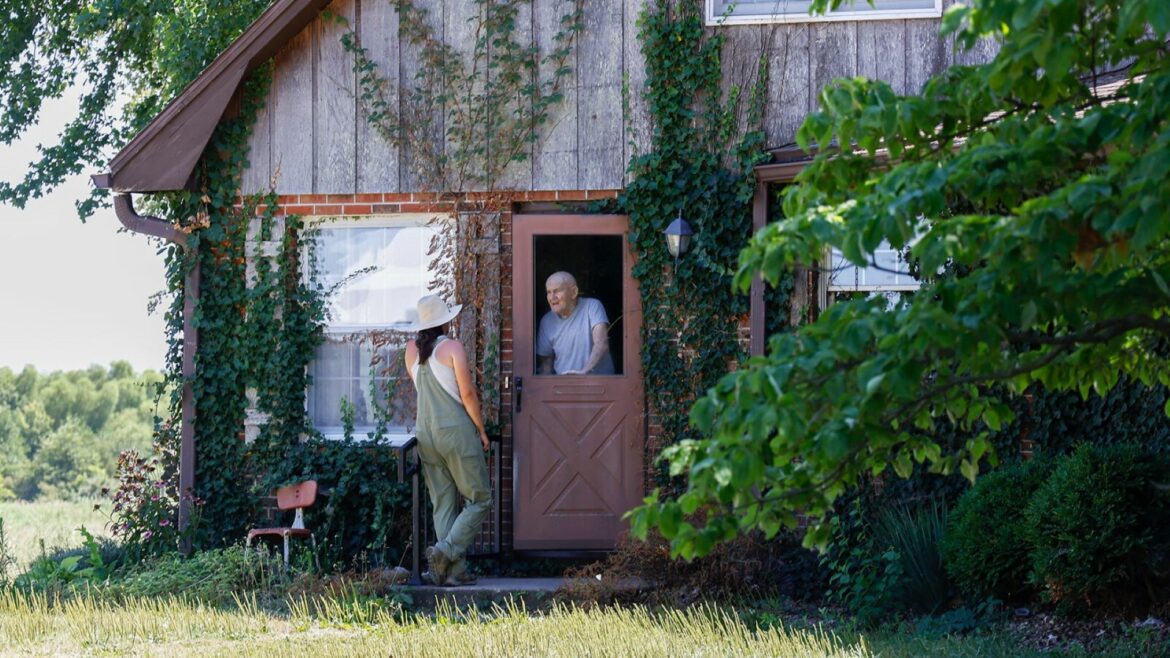 Jordan Welch talks to her grandfather Charlie Payne on July 20 in Concordia.