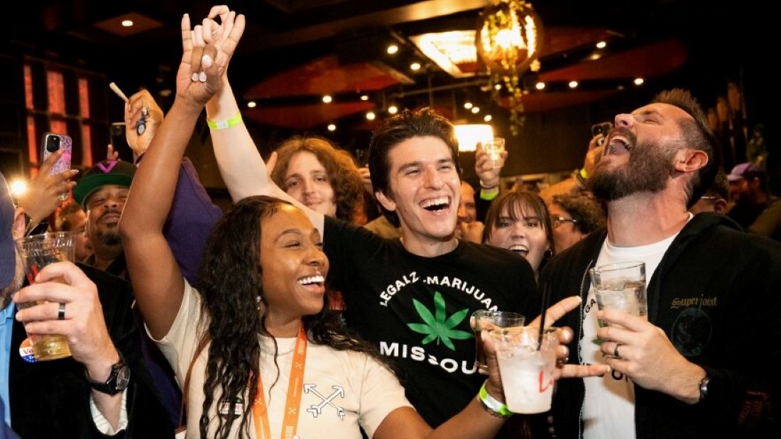 From left: Tanisha Patterson, Ryan Quinones and Chris LeGrand celebrate the passage of Amendment 3 on Tuesday during a watch party at the Crown Room in downtown St. Louis.