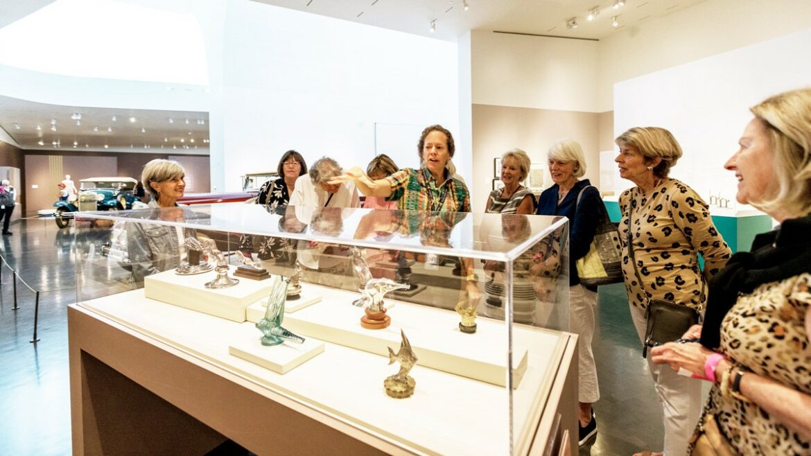 In early September, Nelson-Atkins Museum of Art docent Misty McNally (center) led a group tour of the museum’s “American Art Deco” exhibition, which continues through Jan. 8.