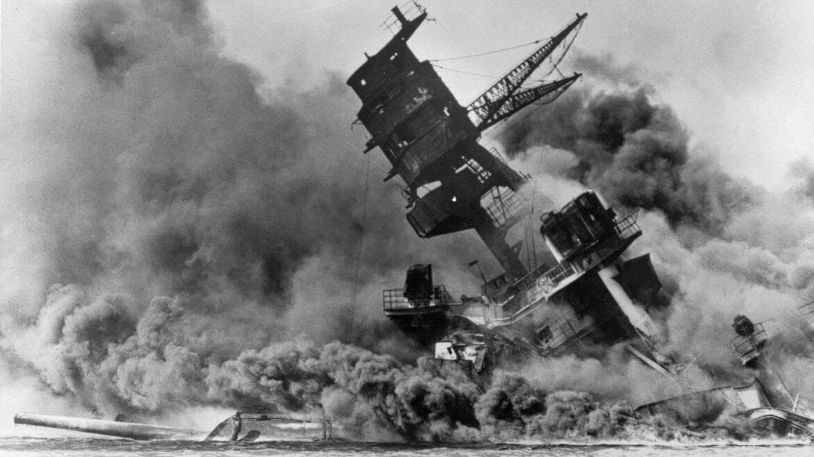In this Dec. 7, 1941, file photo, smoke rises from the battleship USS Arizona as it sinks during a Japanese surprise attack on Pearl Harbor, Hawaii.