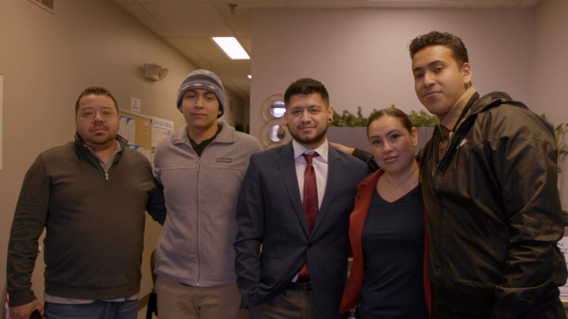 Group of men and woman standing together