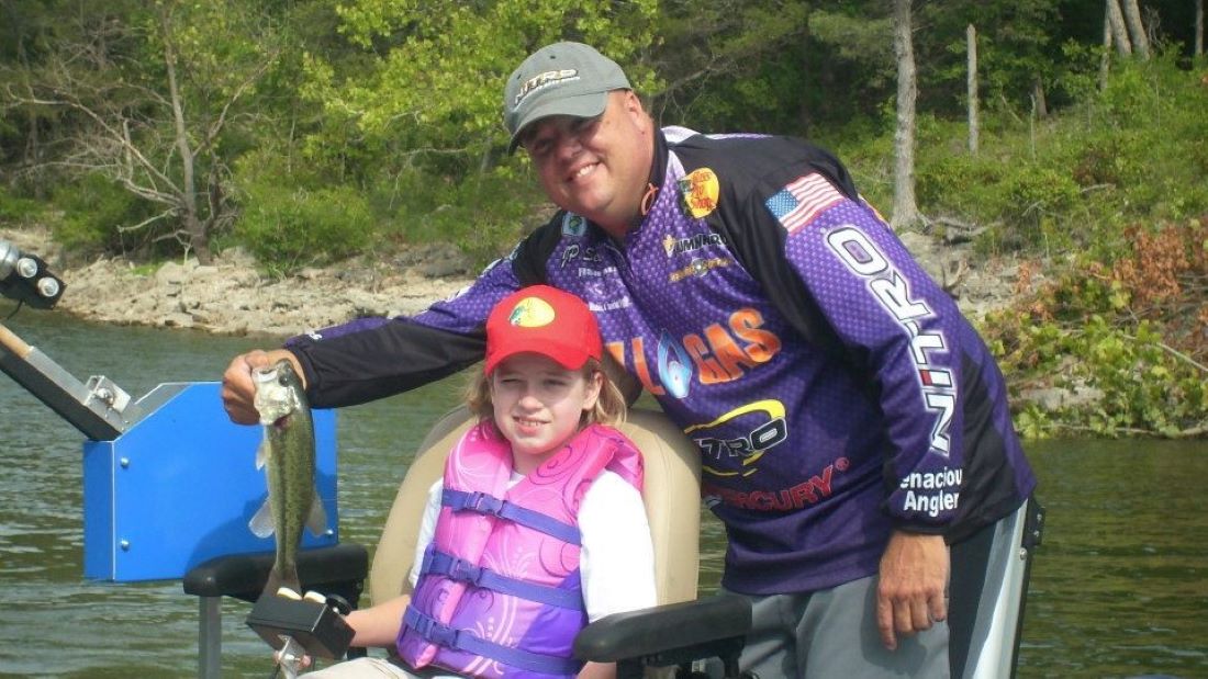 J.P. Sell was all smiles after helping Courtney, who has cerebral palsy, catch her first fish.