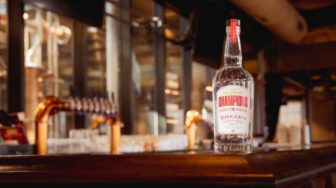 A bottle of J. Rieger & Co.'s special edition wheat vodka honoring the Chiefs sitting on a bar.