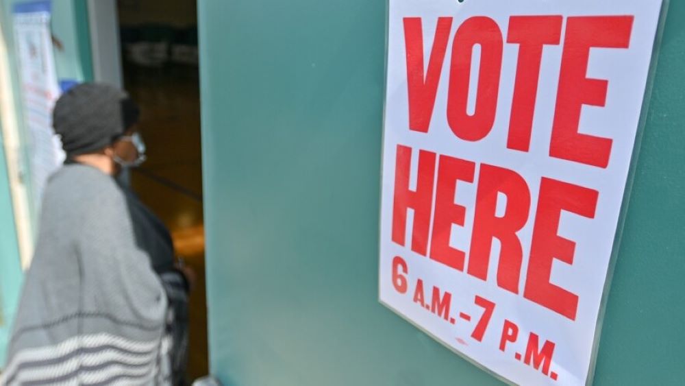 A voter enters the Brush Creek Community Center gym in Kansas City, Missouri, where a polling location was set up on Tuesday, April 4, 2023.
