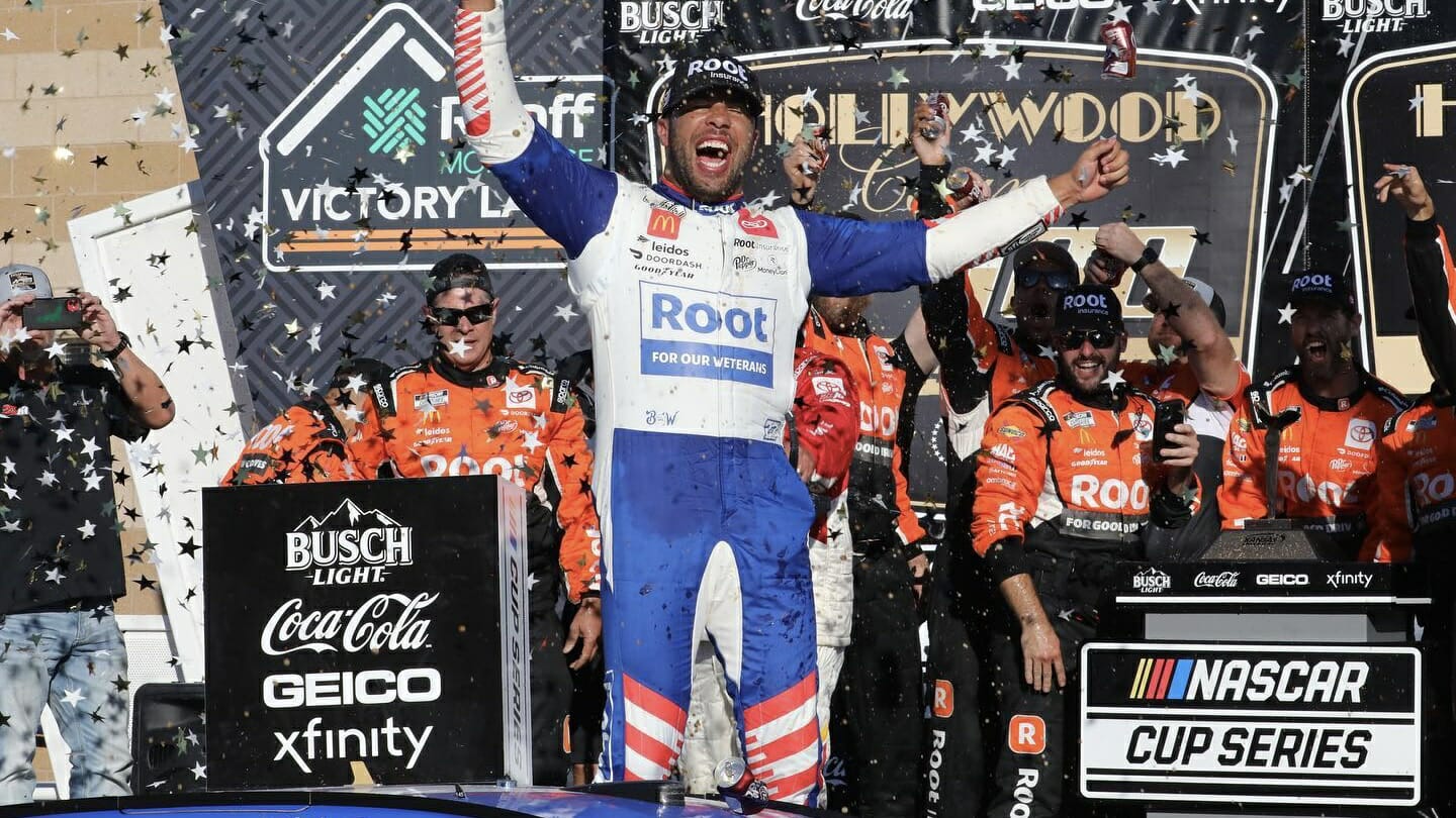NASCAR driver Bubba Wallace celebrates a win at Kansas Speedway.