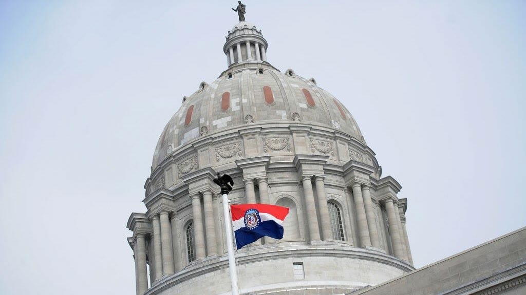 The Missouri state flag is seen flying outside the Missouri State Capitol Building on Jan. 17, 2021, in Jefferson City.