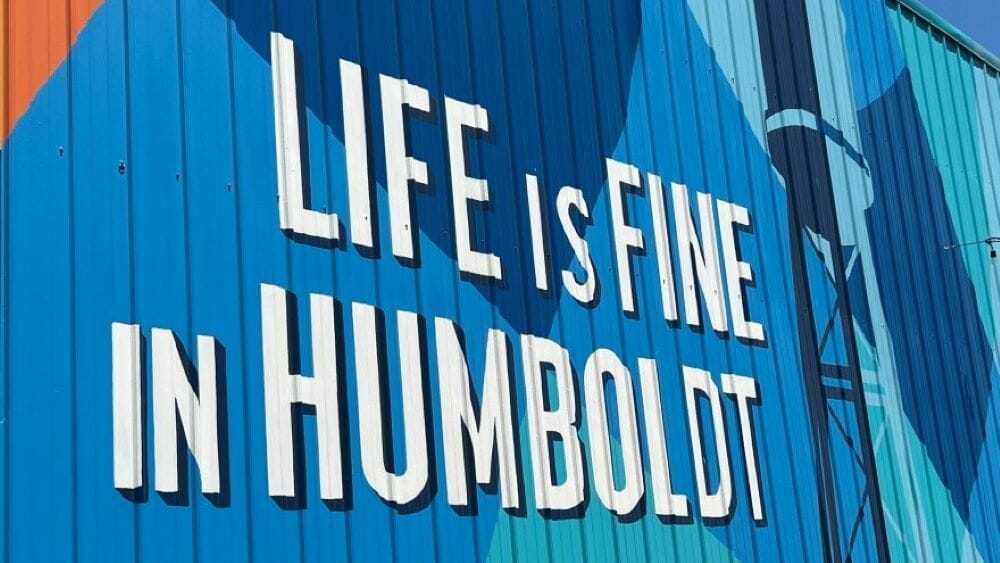 A sign on the side of a building reads "Life is Fine in Humboldt."