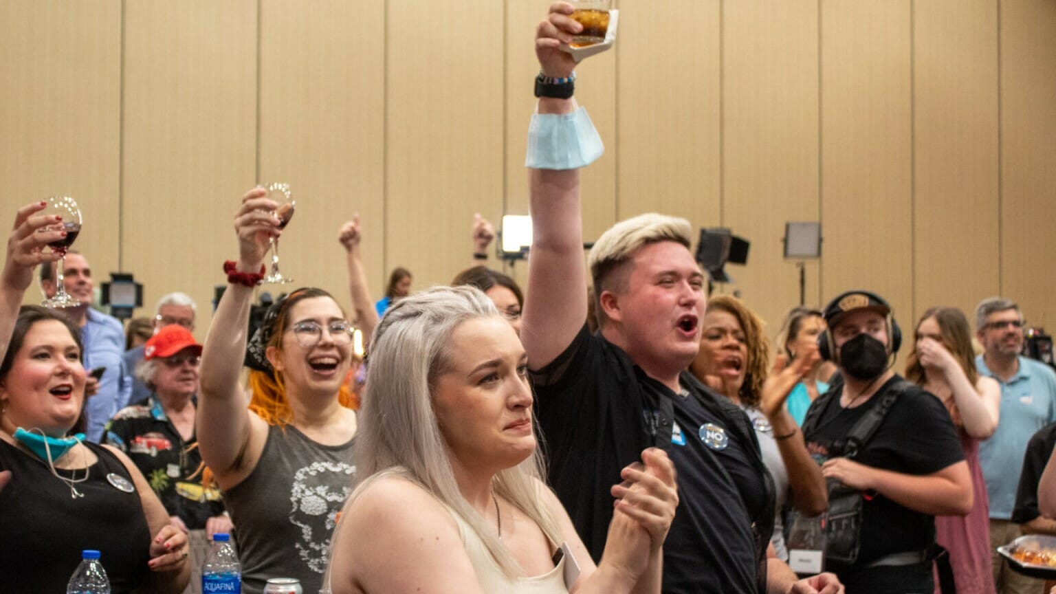 Attendees of the Kansans for Constitutional Freedom watch party celebrate after primary election results verify Kansans voted to keep abortion a constitutional right.